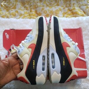 Nike Air Max 90 in White, Black, and Red